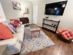 Cozy living room area with a flat screen Roku Smart TV